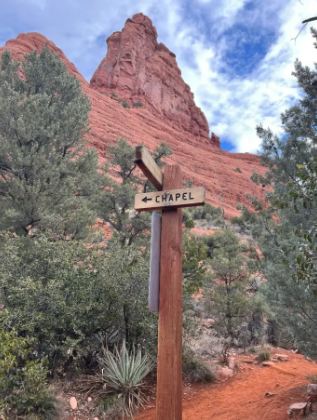 A wooden sign with the word chapel on it
