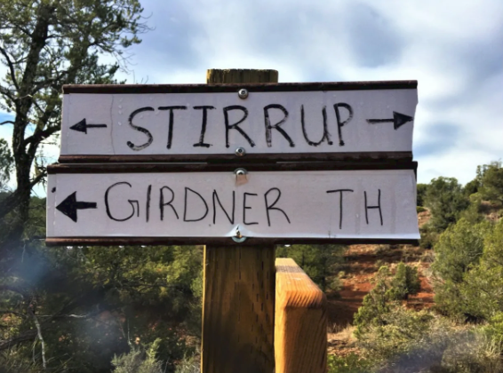 A sign pointing to stirrup and girdner th