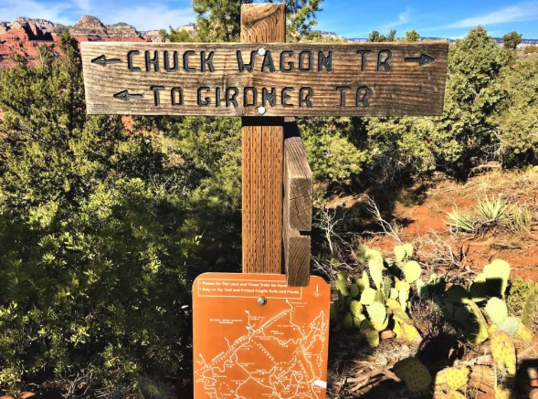 A wooden sign that says chuck wagon tr to gironer tr