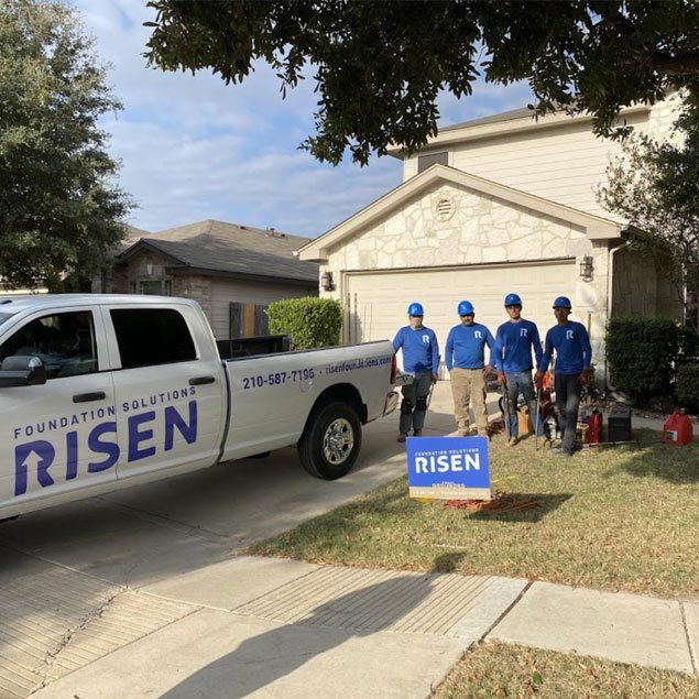 A white truck with the word risen on it