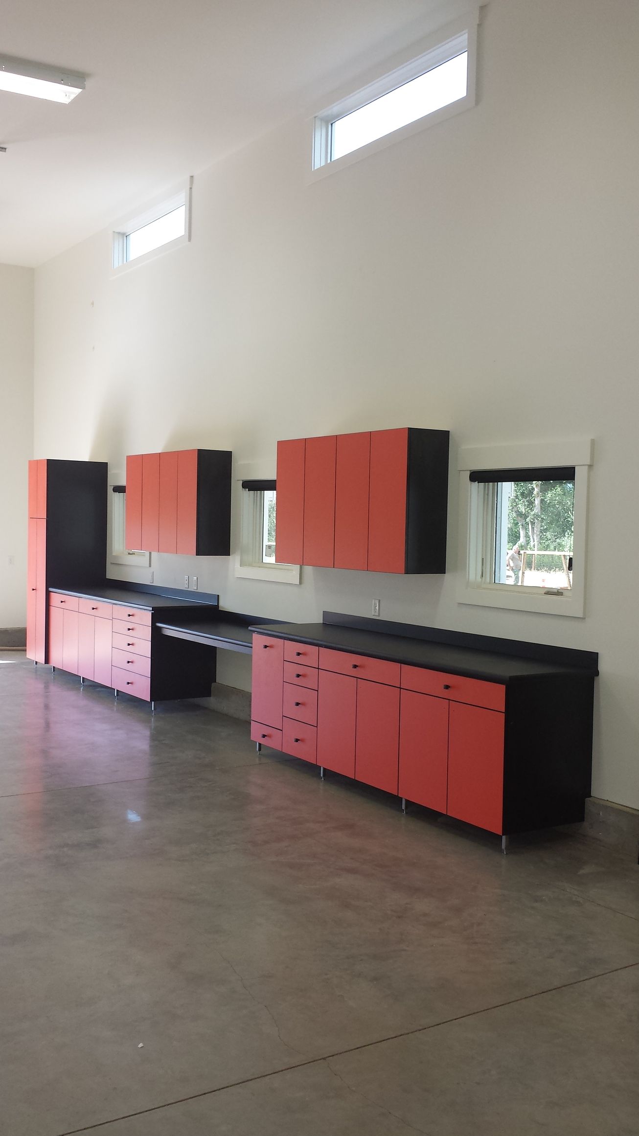 Garage with wood cabinets and a wooden workbench Garage with wood cabinets and a wooden workbench
