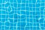 A close up of a swimming pool with blue water and white tiles.