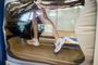 A person is running on a treadmill in a room.