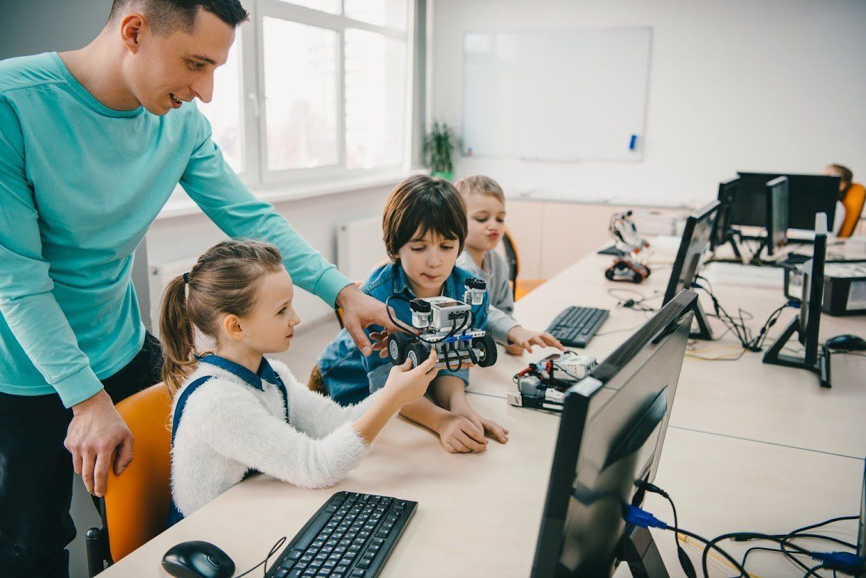 Teacher with His Students — Atlanta, GA — Cleanstar National, Inc. Teacher with His Students — Atlanta, GA — Cleanstar National, Inc.