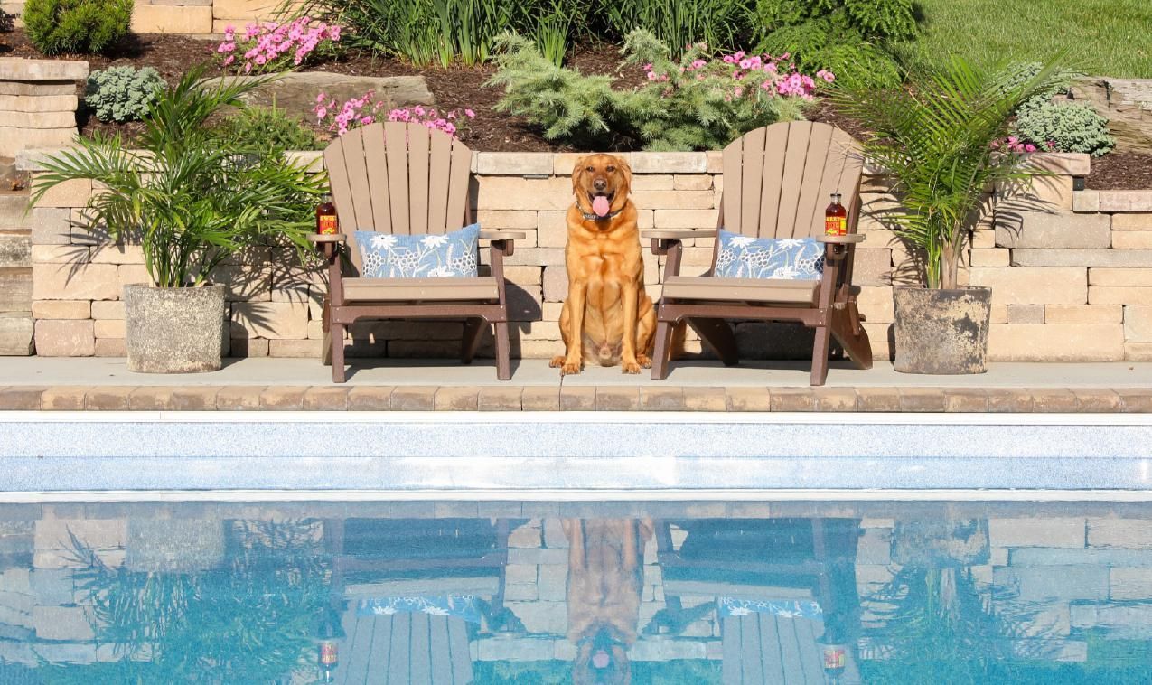 folding Adirondack chairs shown in weatherwood/tudor brown