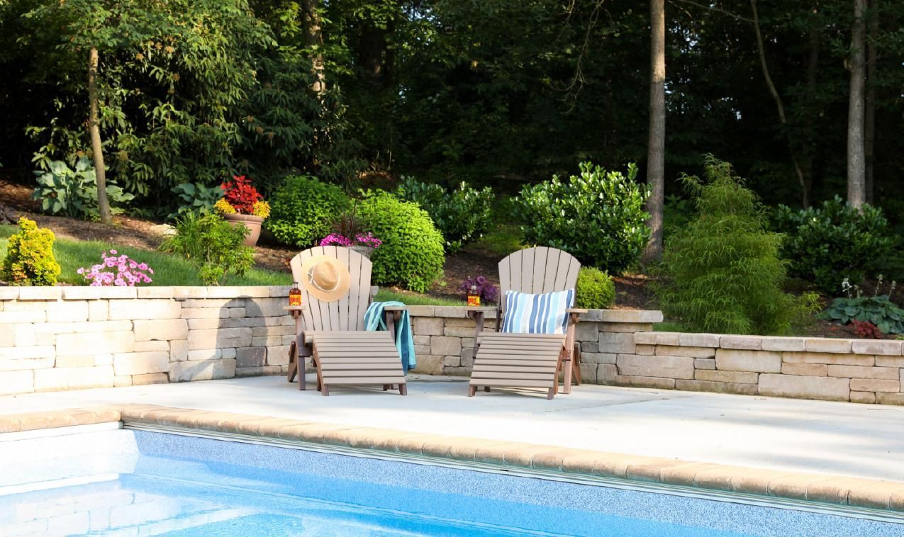 folding adirondack chairs shown in weatherwood/tudor brown