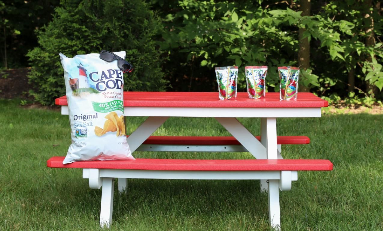 child's picnic table shown in bright red/white