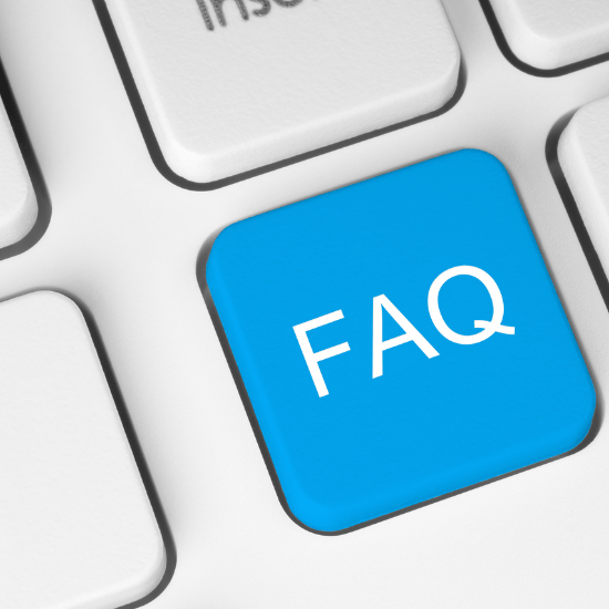 Blue FAQ key on a white keyboard