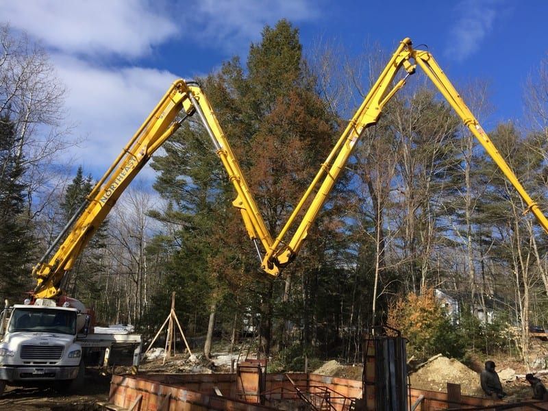 A concrete pump is being used on a construction site