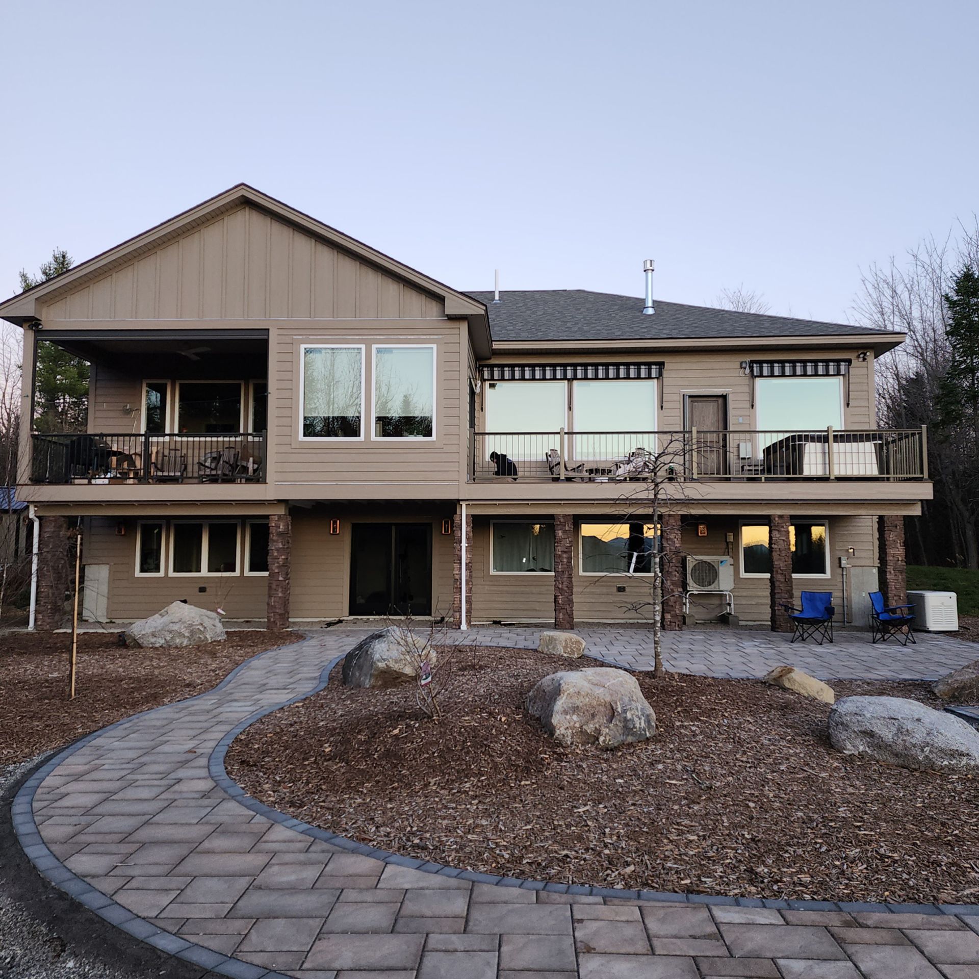 A large house with a walkway leading to it