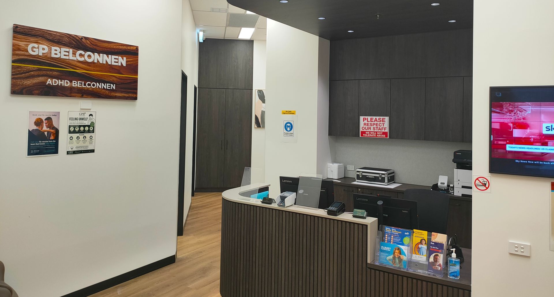 GP Belconnen medical clinic reception area with front desk, signage and patient information brochures.