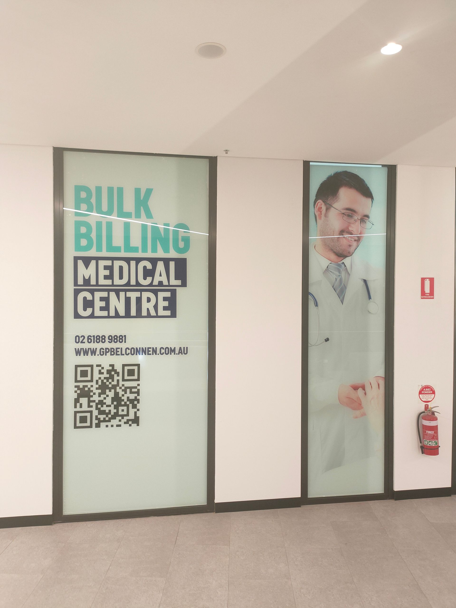 GP Belconnen bulk billing medical centre entrance signage with QR code and clinic contact details.
