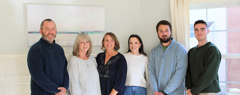 Happy staff members standing together
