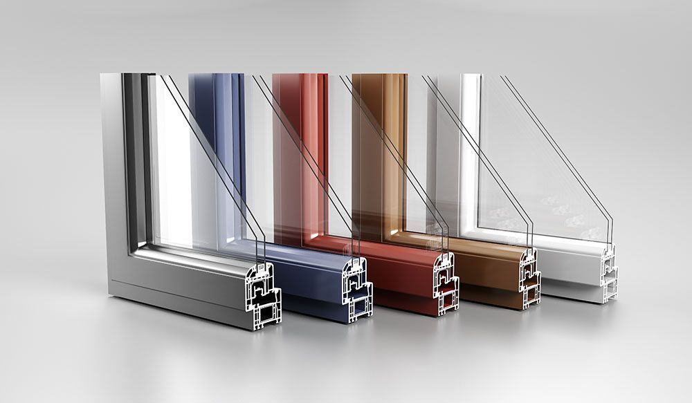 Transparent plastic window profiles in silver, blue, red, bronze, and clear, displayed in a row.