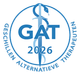 Blue circular logo reading “GAT 2026” with a medical caduceus and “Geschillen Alternatieve Therapeuten” around it