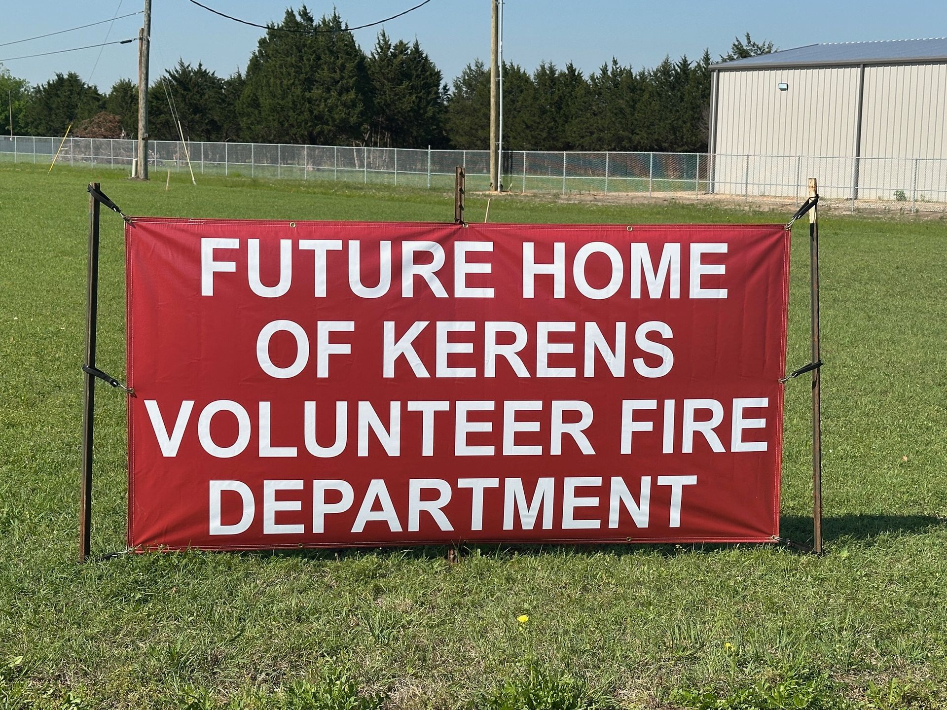 A red sign that says future home of Kerens volunteer fire department