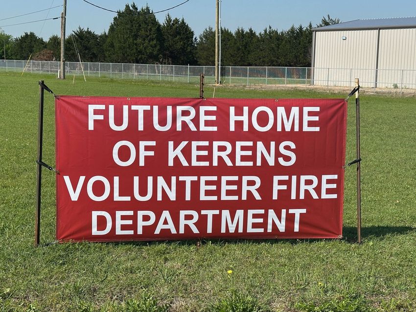 A red sign that says future home of Kerens volunteer fire department