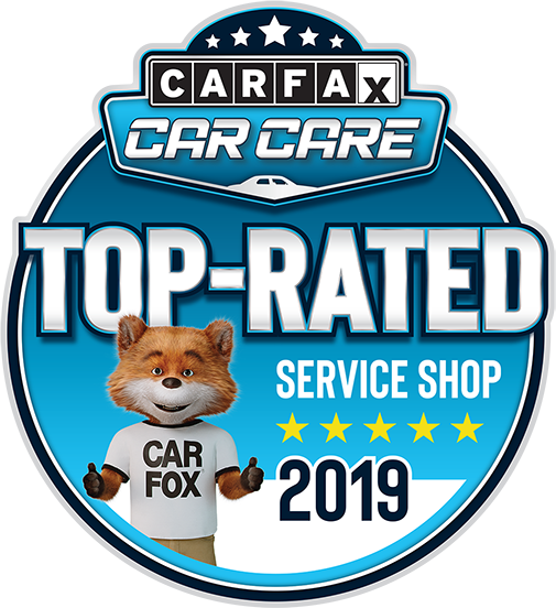 Carfax Top-Rated Service Shop badge with Car Fox mascot giving a thumbs-up. Blue and white colors. 2019. | TNT Tire Point S Auto Service