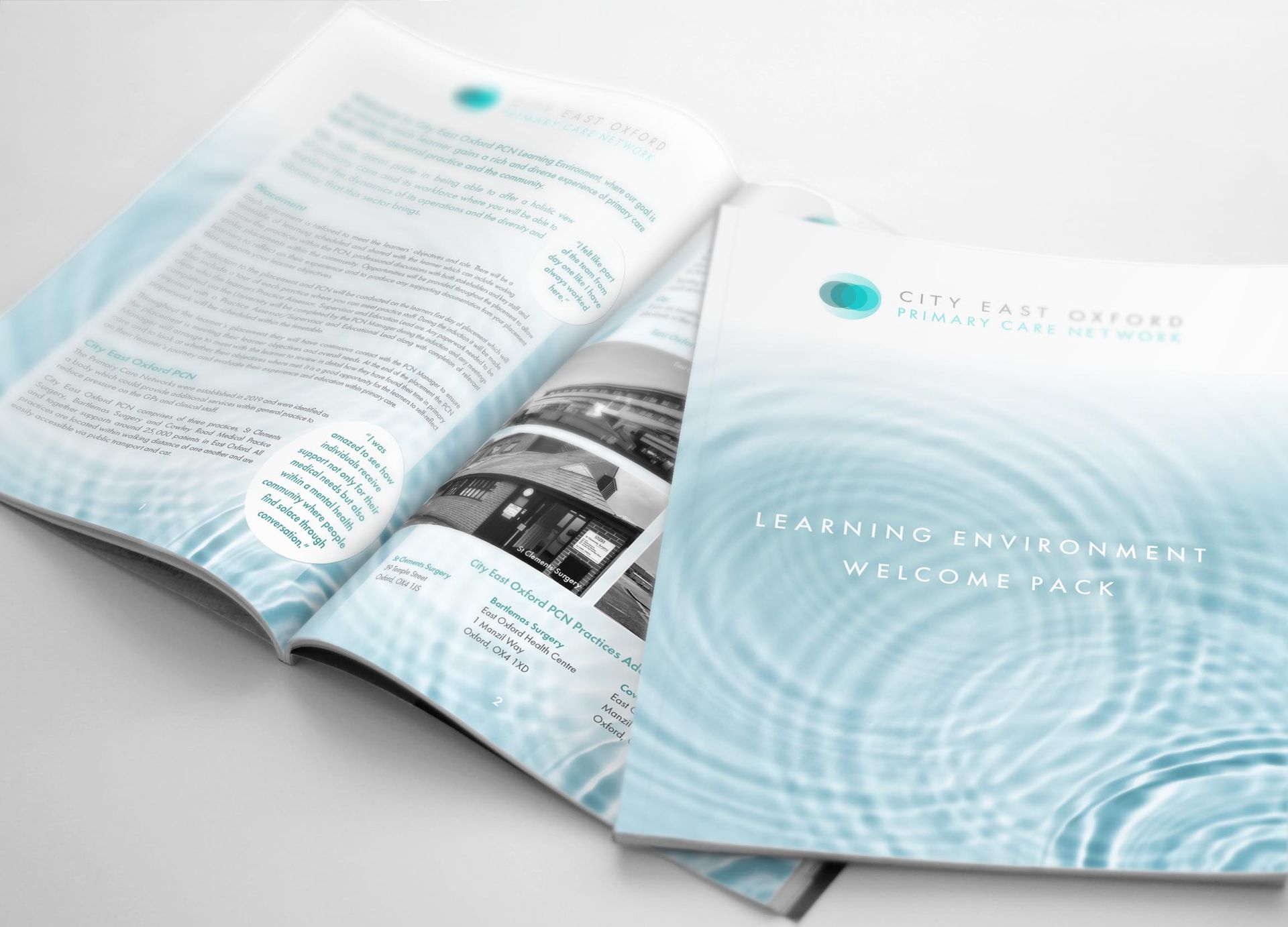 A welcome pack magazine is open with a picture of water on the cover.