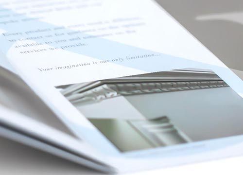 A book is open to a page with a picture of a piece of furniture on it.