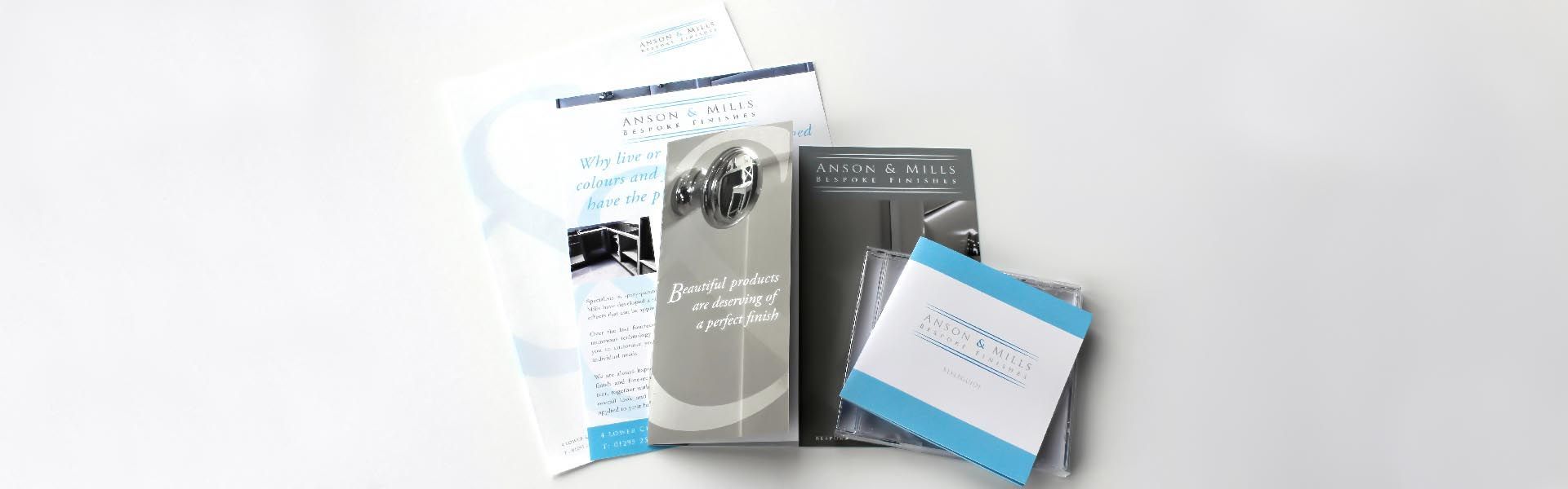 A group of brochures sitting on top of each other on a table.