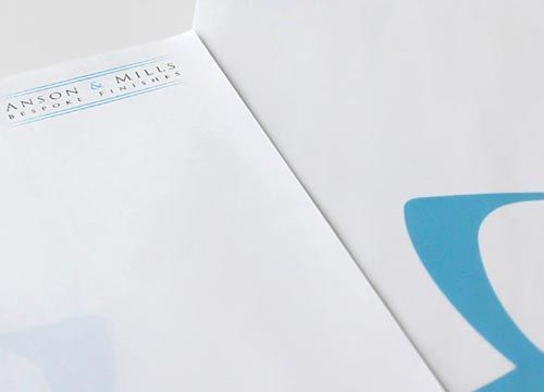 A close up of a piece of paper with the name anson and mills on it
