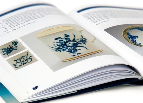 a caughley blue and white patterns book is open to a page with a picture of a blue and white plate on it