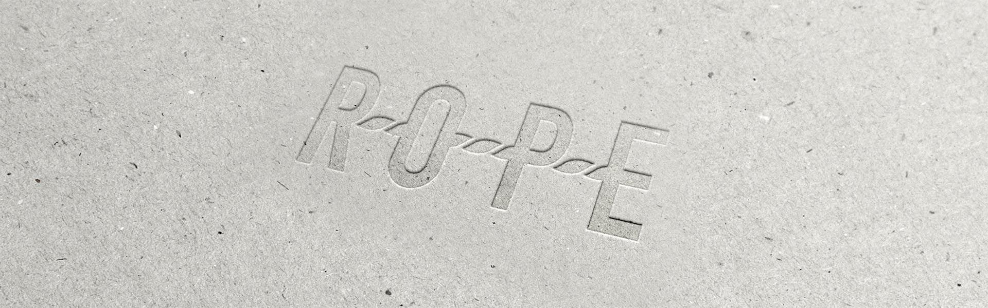 the word rope is embossed into a piece of cardboard
