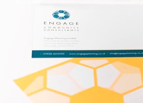 a close up of a business card for engage community consultants .