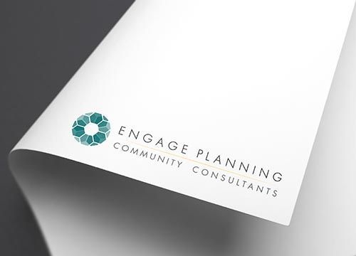 a piece of paper with the logo for engage planning community consultants on it .