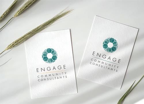 a couple of cards with a logo on them are sitting on a table .
