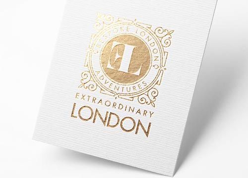 a white piece of paper with a gold logo on it .