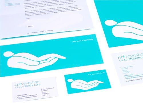 a set of business cards for a dental care company