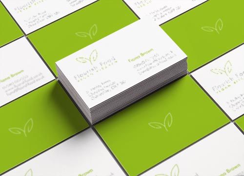 a stack of business cards sitting on top of each other on a table .