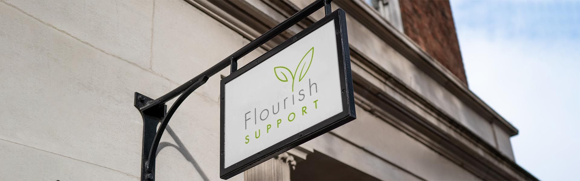 a sign that says flourish support on it