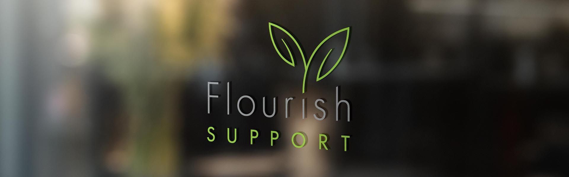 a sign that says flourish support on it