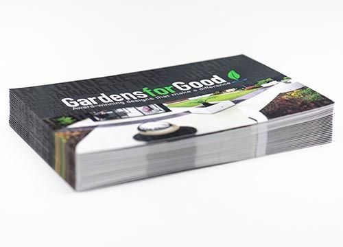 a stack of business cards sitting on top of each other on a table .