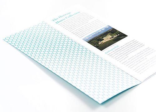 A brochure with a pattern on it is sitting on a table.