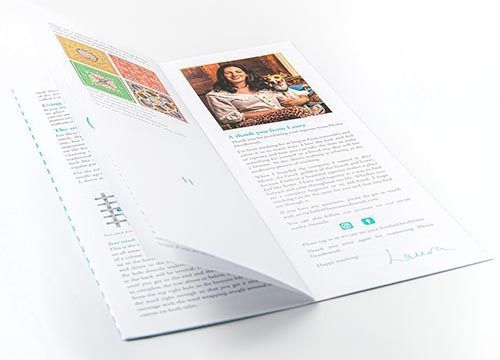 A brochure with a picture of a woman and a dog on it.