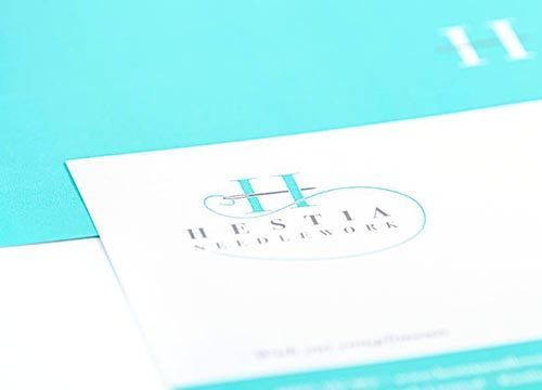 A close up of a business card for hestia studio work