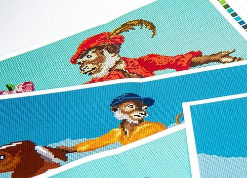 A cross stitch pattern of a monkey and a dog