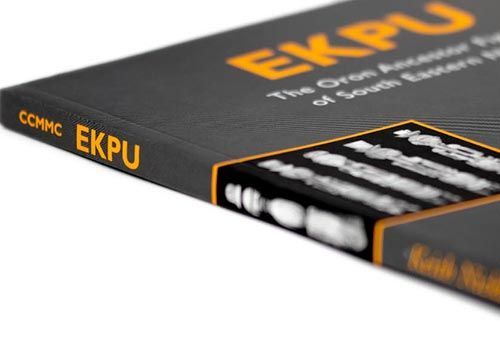 a black book titled ekpu the iron ancestor figures of south eastern nigeria sits on a white surface