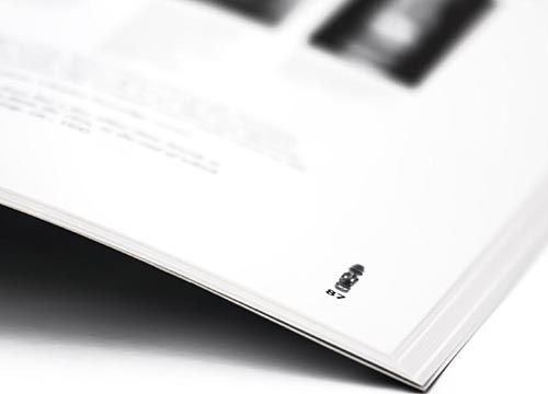 a close up of a book on a white surface