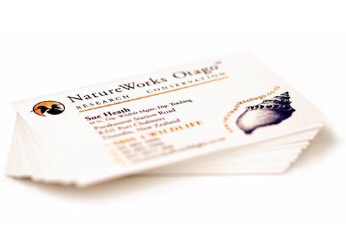a stack of business cards for natureworks otago