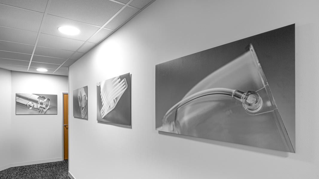 a row of black and white photographs on a wall