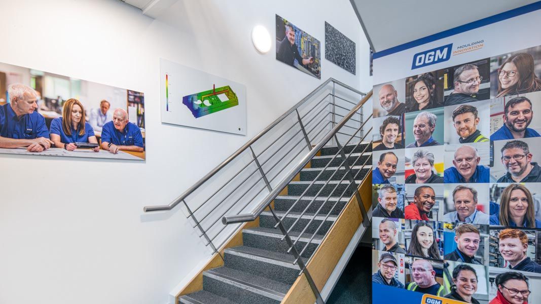 a staircase with a sign that says ogm on it