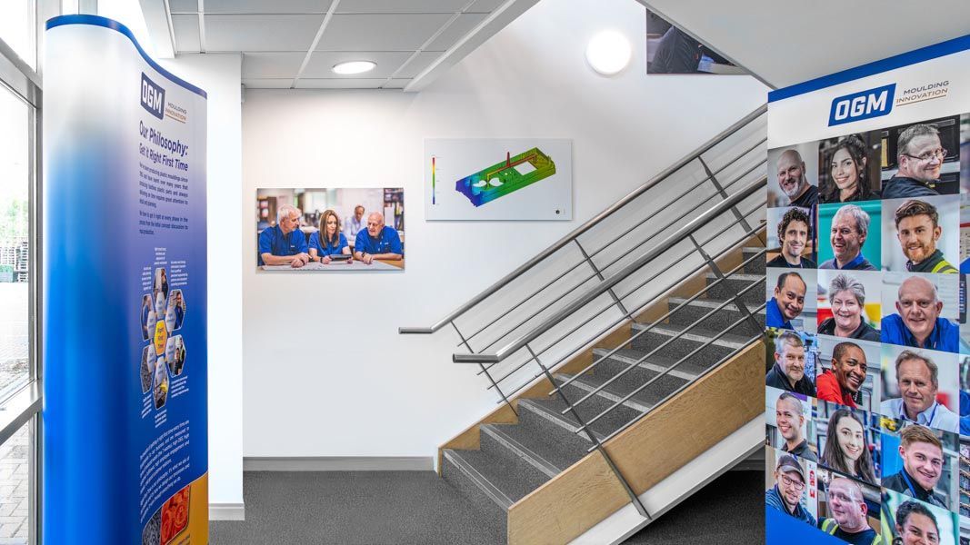 a staircase with a sign that says ogm on it