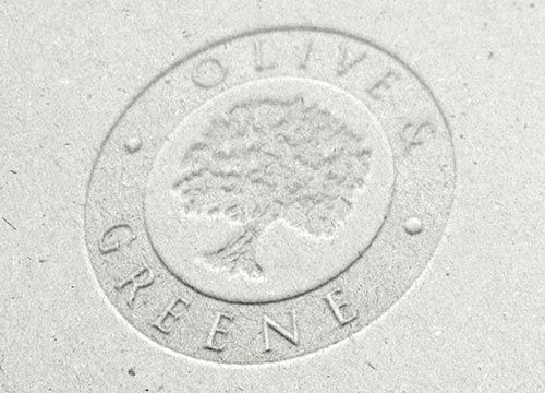 a close up of a logo on a piece of paper with a tree in the center .