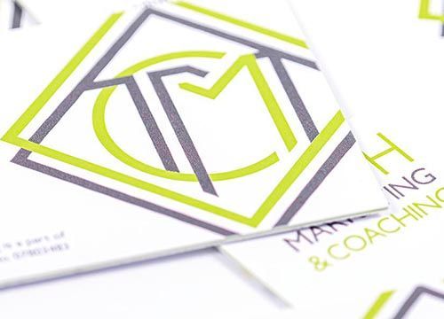 a close up of a business card with the truth marketing and coaching logo on it .