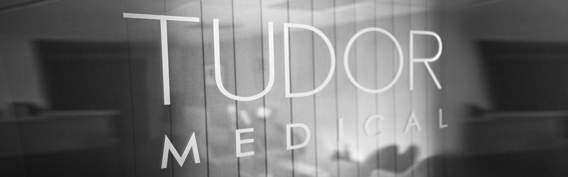 a black and white photo of tudor medical window vinyl